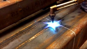 Pro Weld owner Jim Oberlander oxy acetylene torches circle in industrial tube stee.l.